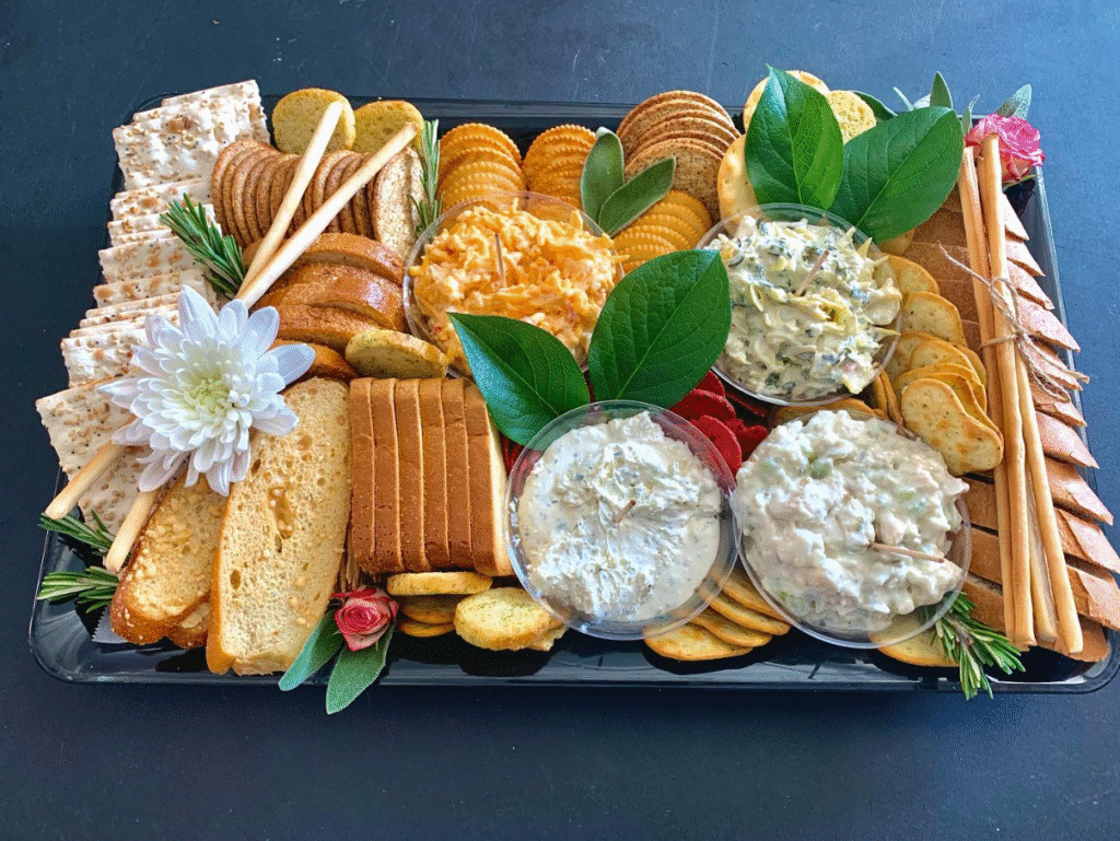 Dip and cracker board with spreads, breads, and artisanal crackers