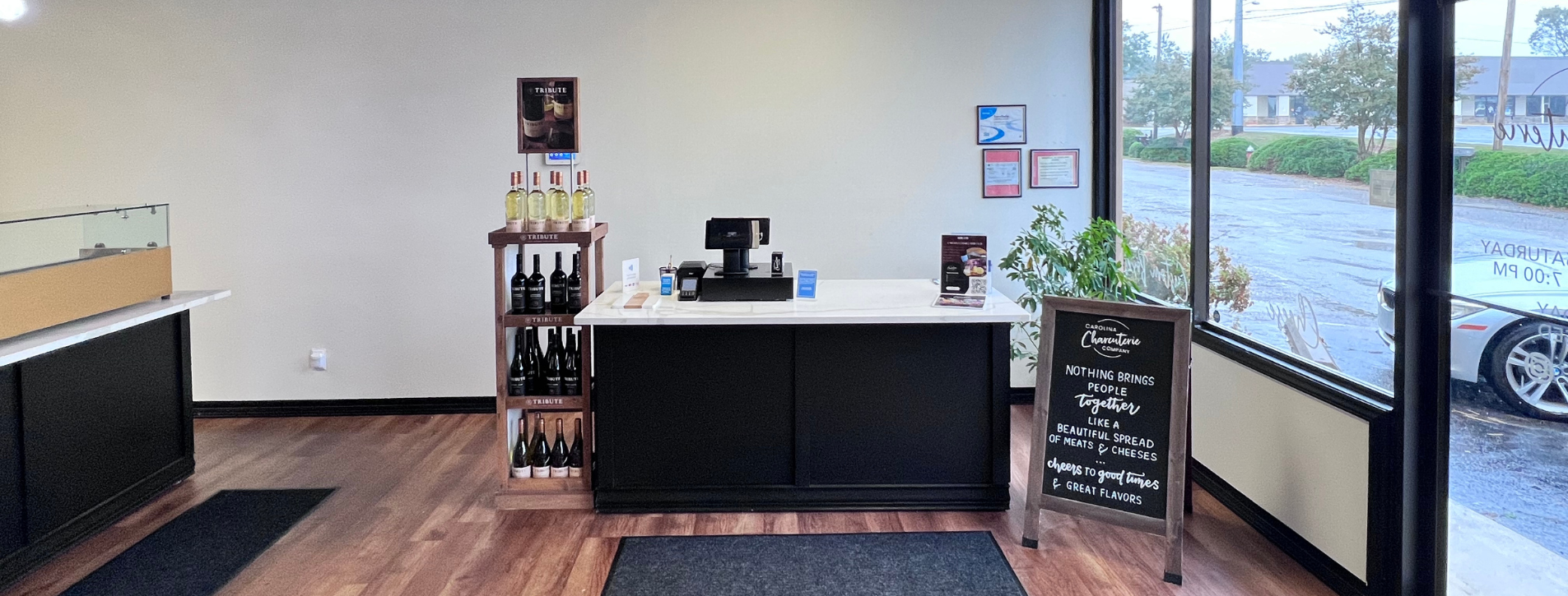 Interior view of the checkout and counter area at Carolina Charcuteri